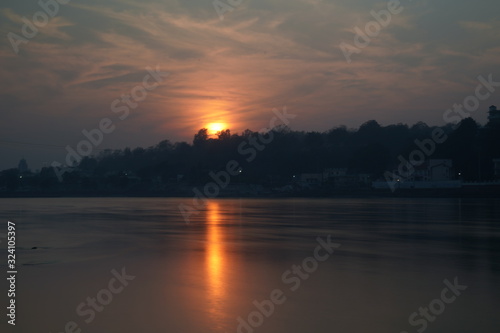 Beautiful sunset view of the river Ganga in Rishikesh, India © shalender