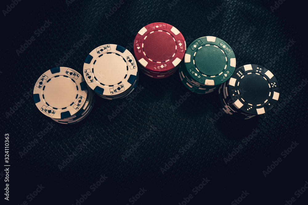 Stacks of poker chips on background in Casino