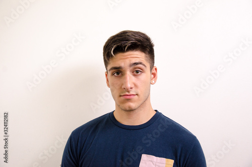 Canvastavla Young male Caucasian looking straight at the camera