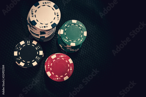 Foto Stacks of poker chips on background in Casino