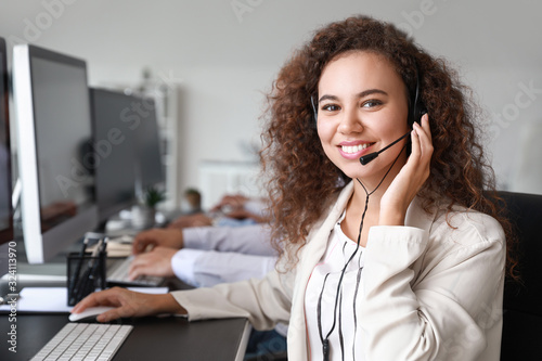 Portrait of female technical support agent in office