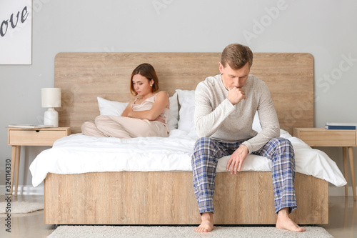 Sad couple after quarrel in...