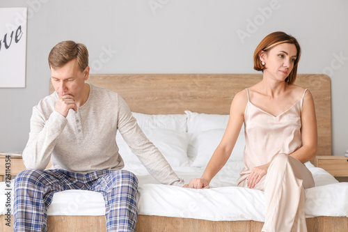 Sad couple after quarrel in...