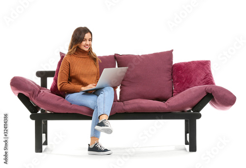 Young woman with laptop sit...