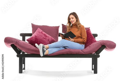 Young woman reading book wh...