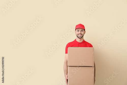 Delivery man with boxes on ...