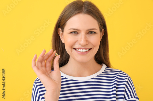 Young woman with fish oil o...