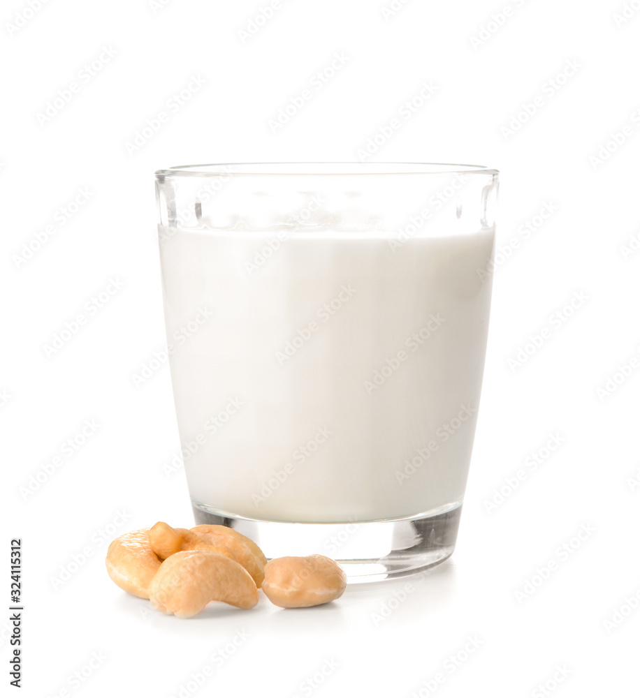 Glass of fresh cashew milk on white background Glass of fresh cashew milk on white background