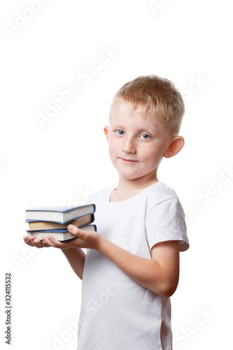 little boy holds books in hands