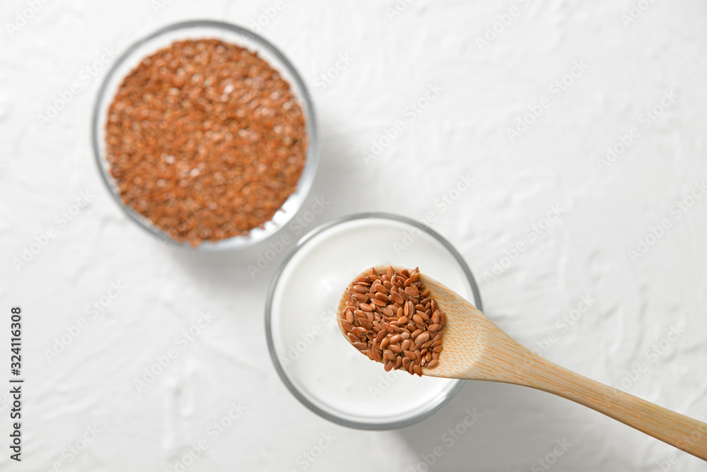 Spoon with flax seeds over table