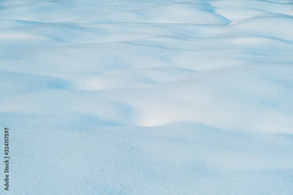 White and blue snowy texture of natural snow surface