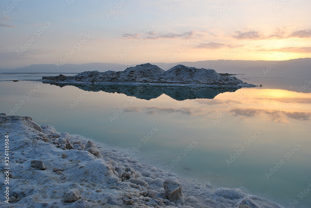 Sunrise over the Dead Sea shore in Israel. The lowest place on Earth. Salt crystals at sunrise