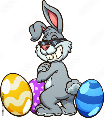 Cool Easter bunny wearing sunglasses and standing among Easter eggs. Vector clip art illustration with simple gradients. Some elements on separate layers..