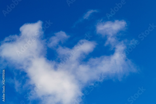 Bright white clouds on blue sky. Beautiful background.