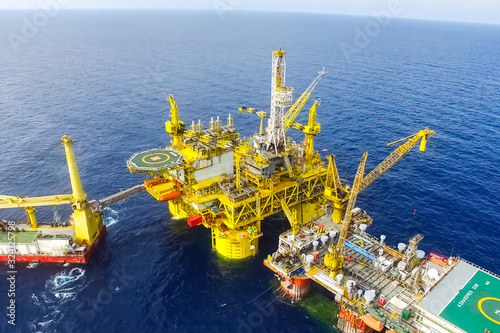 Towing of the oil platform. Drilling platform in the port.