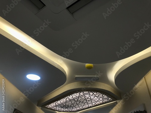 Photography A Decorative Gypsum board suspended false ceiling with Coves for indirect lighti