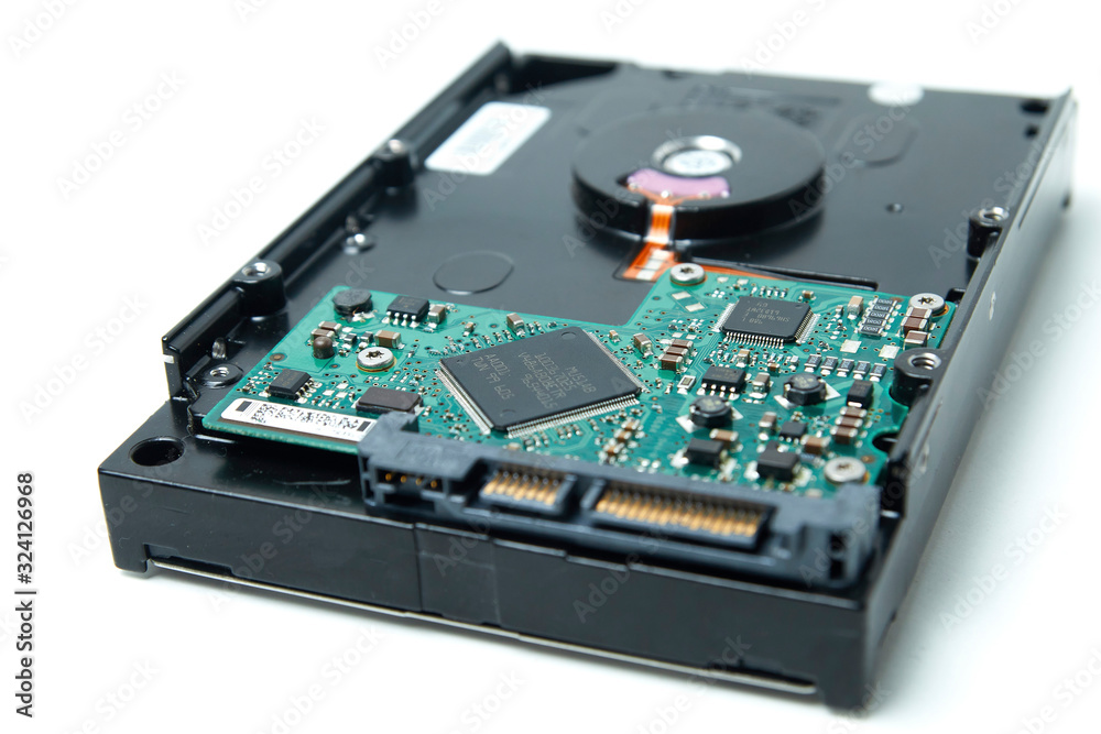 Opened hard drive from the computer hdd disk drive with mirror effects. Disassembled hard drive from the computer Opened hard drive from the computer hdd disk drive with mirror effects. Disassembled hard drive from the computer