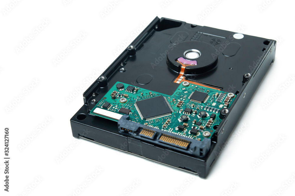 Opened hard disk drive, HDD. Disassembled hard drive from the computer on isolated white background Opened hard disk drive, HDD. Disassembled hard drive from the computer on isolated white background