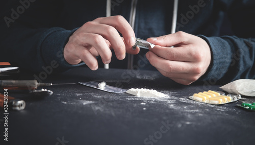 Drug addict taking cocaine. Addiction