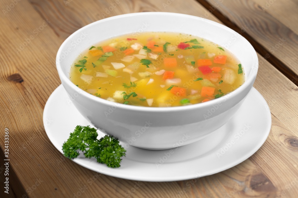 Bowl of delicious vegetable soup on a table Bowl of delicious vegetable soup on a table