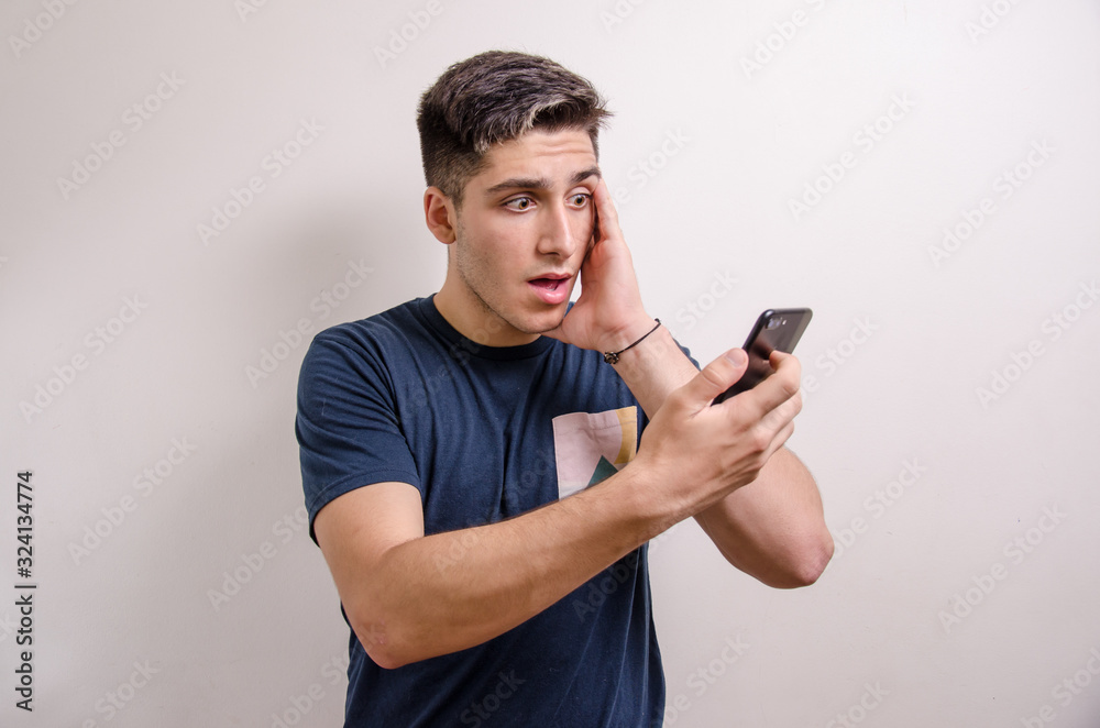 Young man with his cell phone Young man with his cell phone
