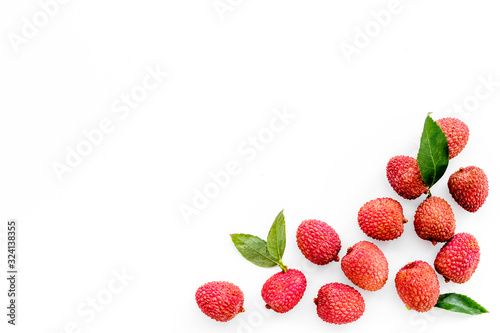 Lychee frame. Fresh juicy fruits on white background top-down copy space