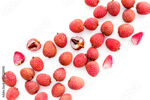 Lychee pattern. Exotic asian fruits on white background top-down copy space