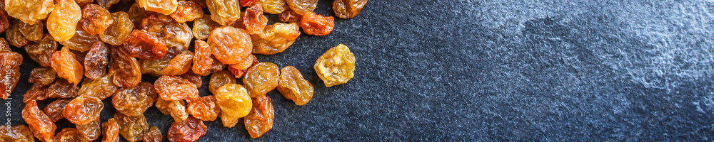 raisins, delicious dried grapes (fresh fruit vitamins) menu concept background. top view. copy space raisins, delicious dried grapes (fresh fruit vitamins) menu concept background. top view. copy space