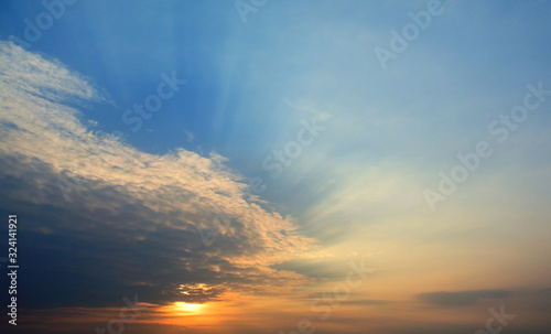 Sunset light shining through the clouds © Beach boy 2024