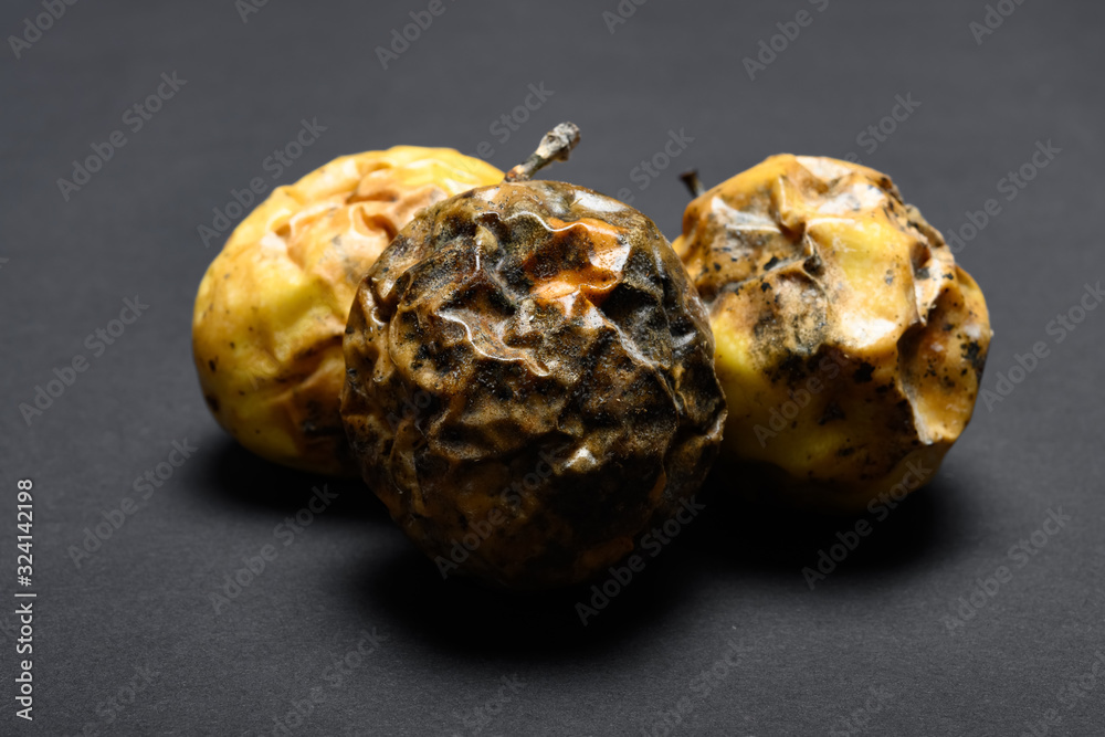 over ripe passion fruits on a dark background over ripe passion fruits on a dark background