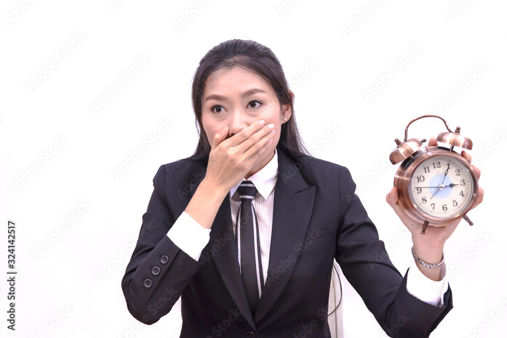 Business young Asian. Was shocked when looking at the time from the clock because of time make an appointment for a long time, white background Business young Asian. Was shocked when looking at the time from the clock because of time make an appointment for a long time, white background