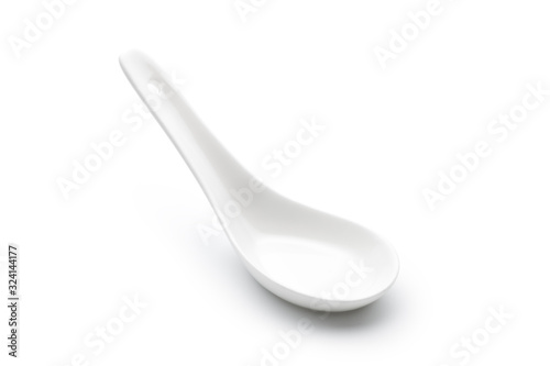 Empty ceramic spoon isolated on white background