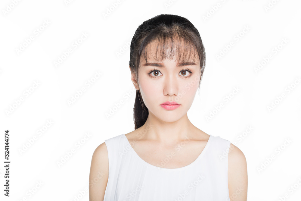headshot of young woman looking at camera over white background. headshot of young woman looking at camera over white background.