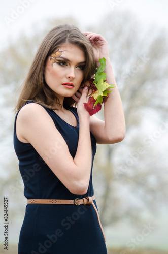 beautiful sexy girl, posing in the nature, autumn dresses photo