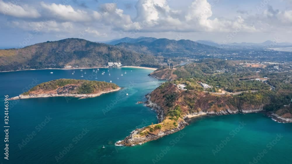 Hyperlapse of southern area of Phuket island with its beaches and islets and clouds running in the sky. Thailand. Timelapse with descending camera and zoom out effect Hyperlapse of southern area of Phuket island with its beaches and islets and clouds running in the sky. Thailand. Timelapse with descending camera and zoom out effect