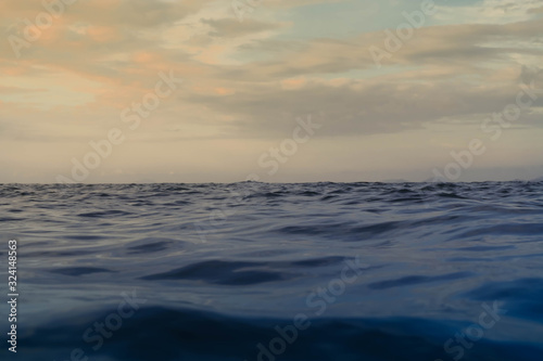 Sky and Sea wave low angle view in morning. Ocean water background. ocean wave close up view