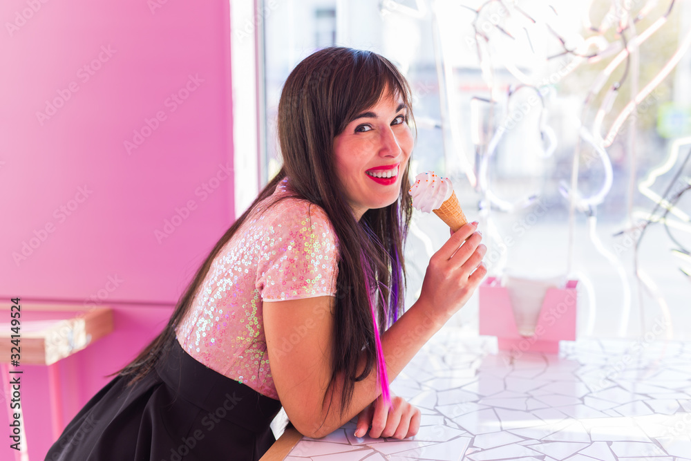 Summer, youth and dessert concept - Pretty girl enjoying an ice-cream cone in cafe Summer, youth and dessert concept - Pretty girl enjoying an ice-cream cone in cafe