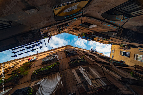 old street in barcelona spain against blue sky