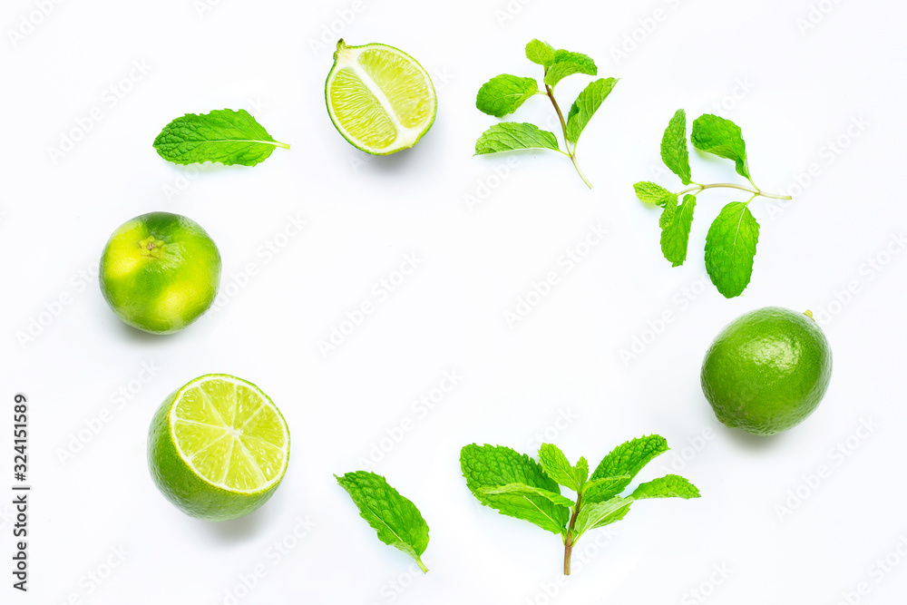 Limes with mint leaves isolated on white background.