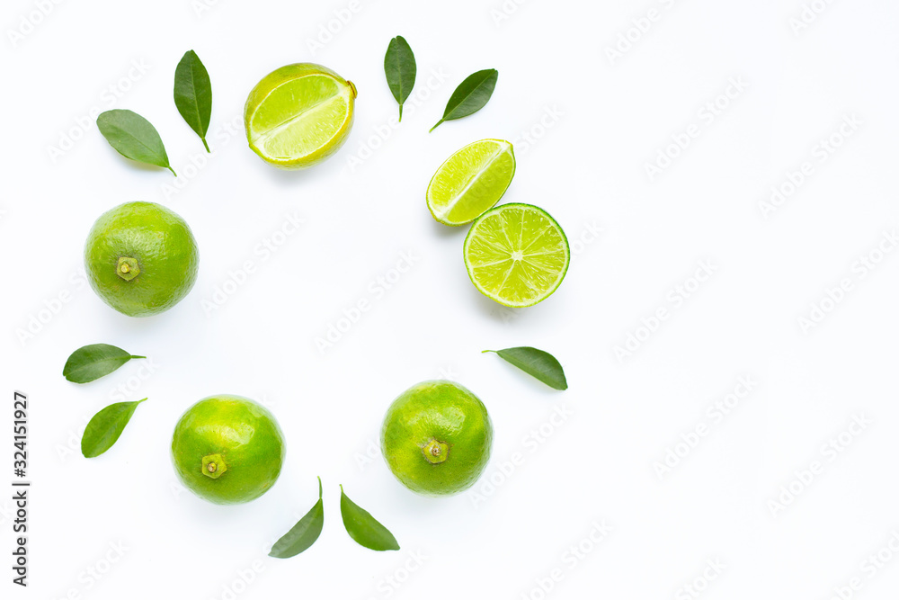 Composition with fresh limes on white background.