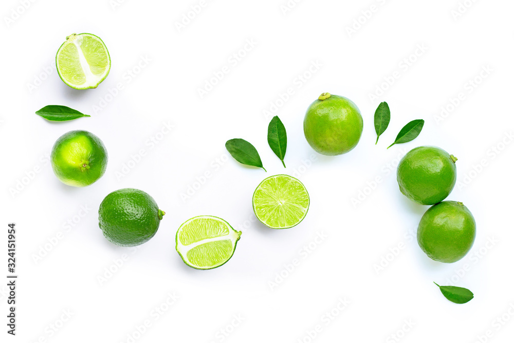 Composition with fresh ripe limes on white background.