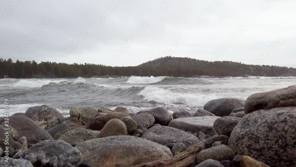 Waves crashing over rocks panning left Waves crashing over rocks panning left