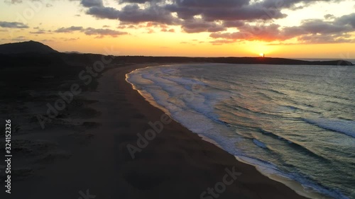 Beautiful Sunset at Beach of Valdovino, aerial zoom out view. Drone footage photo