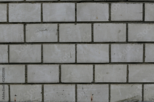 old rough gray brick wall