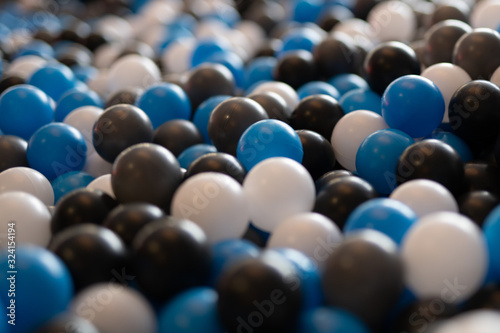 plastic balls blue white black in a palyground  photo