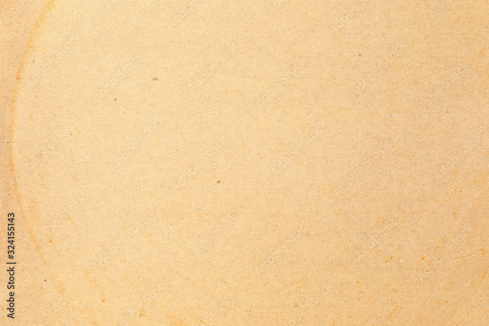 Brown kraft paper background texture with grain and dots Brown kraft paper background texture with grain and dots