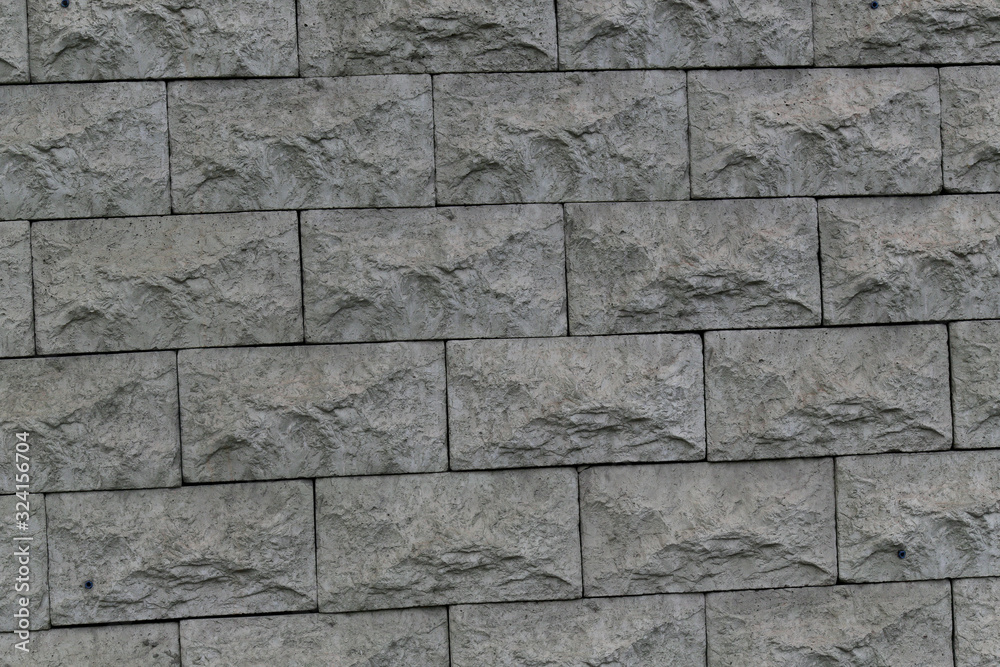 Fototapeta premium gray rough brick wall abstract background