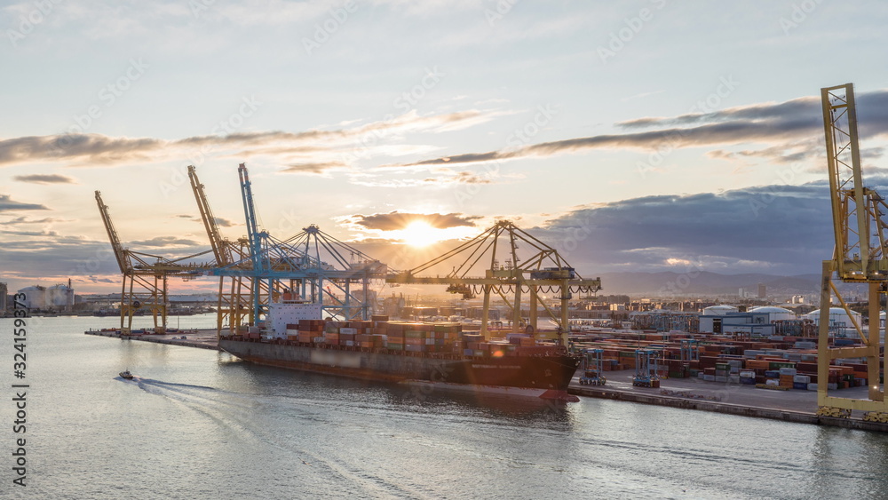 Fototapeta premium Aerial view of the sea cargo port and container terminal of Barcelona timelapse, Barcelona, Catalonia, Spain.