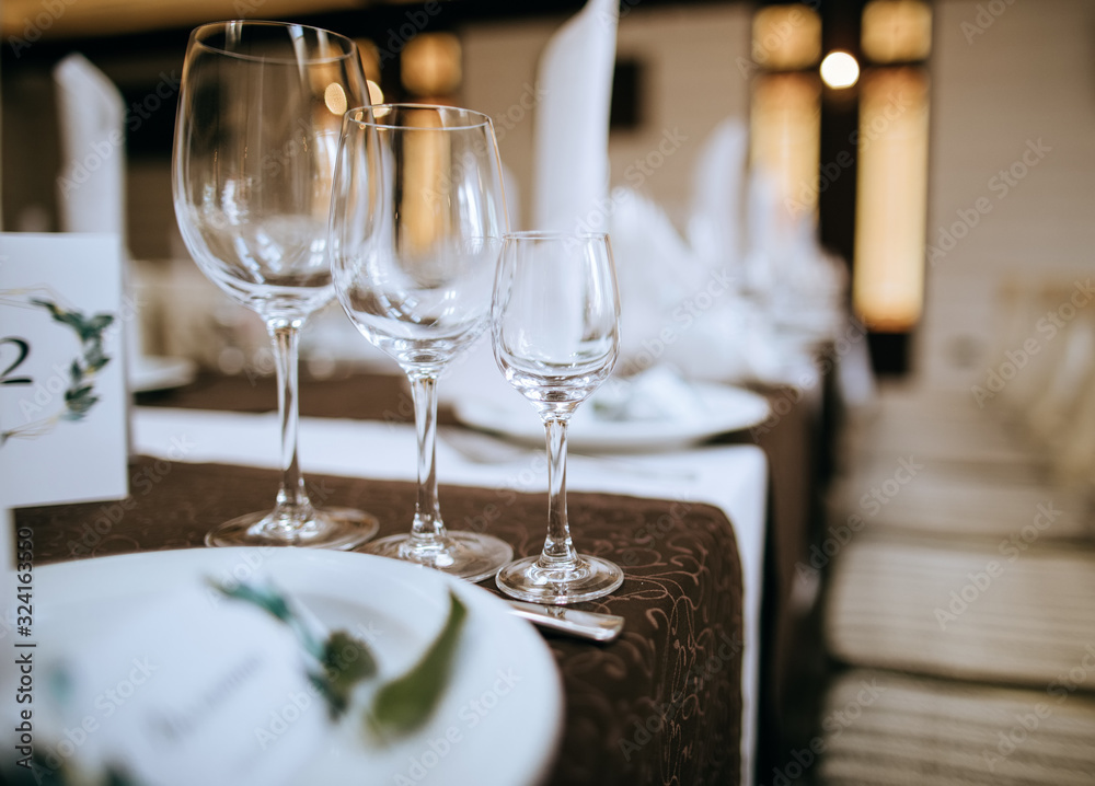 Glasses on table, Table set for an event party Glasses on table, Table set for an event party