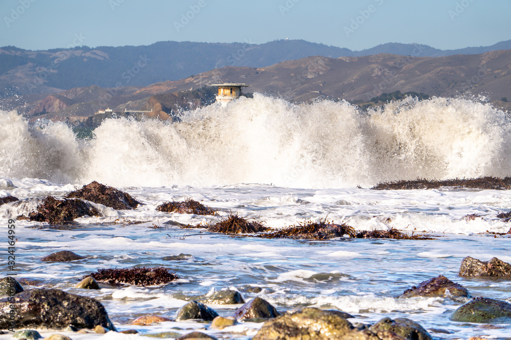 waves crushing against rocks